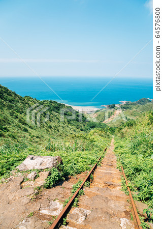 Yinyanghai sea and railroad in Jinguashi, Taiwan 64576800
