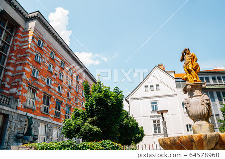 National and University Library of Slovenia and Fountain of Neptune in Ljubljana, Slovenia 64578960