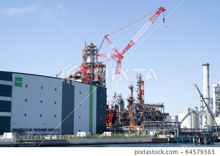 View of factories in the industrial area and equipment under construction View of factories in the industrial area and equipment under construction 64579383