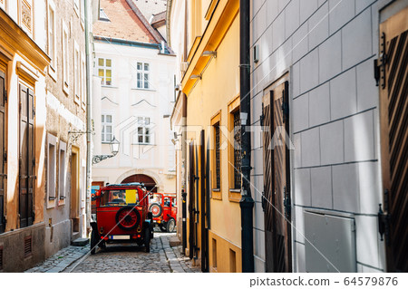 Old town street and city tour car in Bratislava, Slovakia Old town street and city tour car in Bratislava, Slovakia 64579876