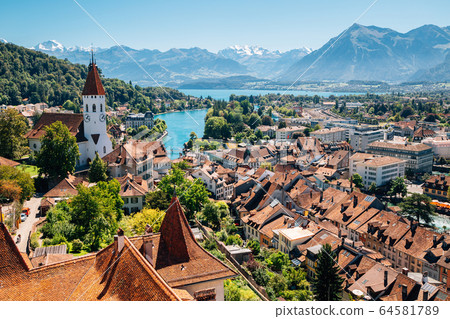 Thun cityscape with Alps mountain and lake in Switzerland 64581789