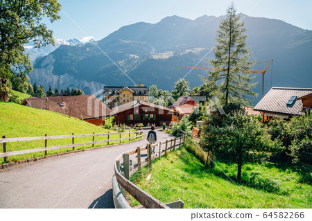 Wengen village and alps nature view in Switzerland 64582266