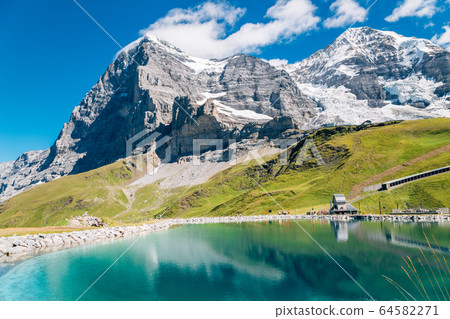 Fallbodensee lake and snowy mountain at Jungfrau region in Switzerland 64582271