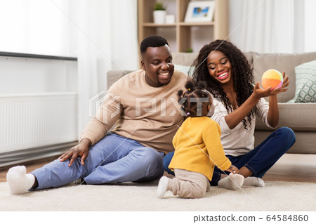 african family playing with baby daughter at home 64584860