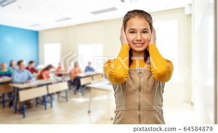 student girl closing ears by hands at school 64584879