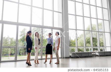 businesswomen meeting at office and talking businesswomen meeting at office and talking 64585153