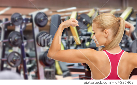 Portrait of Young Fitness Woman Shows Biceps Stock Image - Image