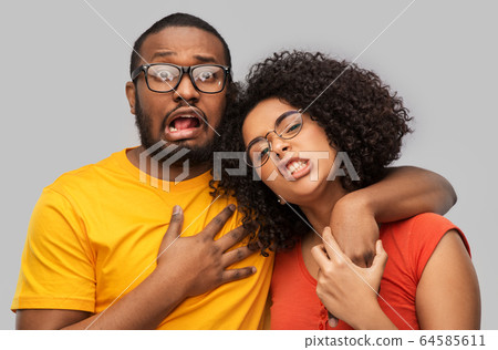 happy african american couple in glasses hugging happy african american couple in glasses hugging 64585611