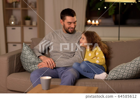 happy father and little daughter at home at night happy father and little daughter at home at night 64585612