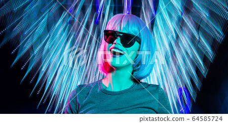 happy woman in pink wig and black sunglasses 64585724