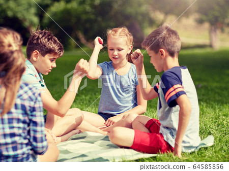 happy kids playing rock-paper-scissors game happy kids playing rock-paper-scissors game 64585856