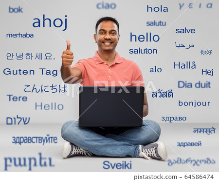 happy indian man with laptop showing thumbs up happy indian man with laptop showing thumbs up 64586474