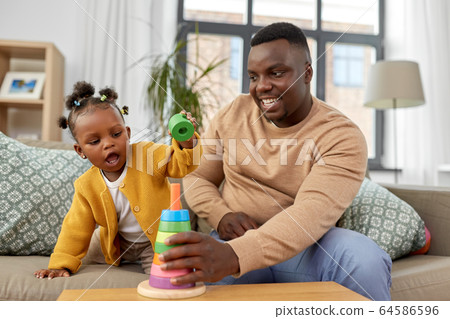 african family playing with baby daughter at home african family playing with baby daughter at home 64586596