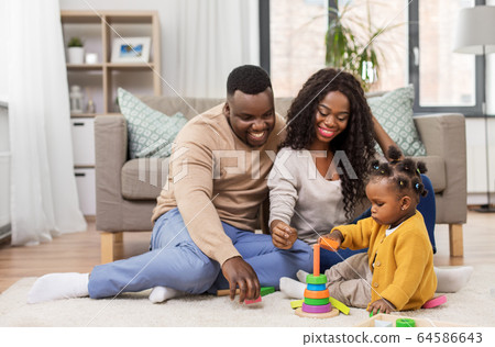 african family playing with baby daughter at home 64586643