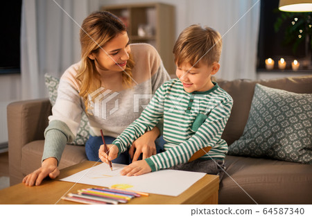mother and son with pencils drawing at home mother and son with pencils drawing at home 64587340