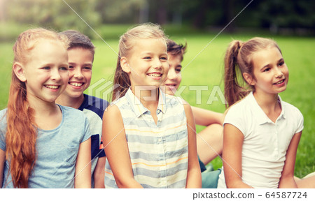 group of happy kids or friends outdoors 64587724