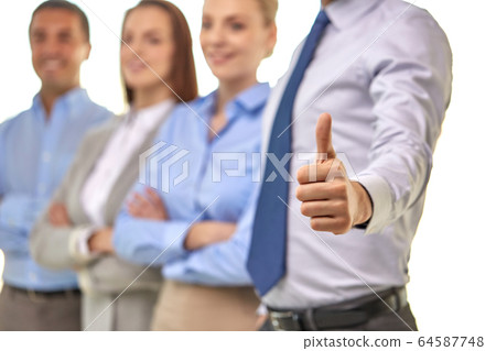 close up of businessman showing thumbs up 64587748