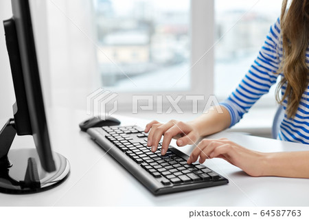 close up of teenage girl with computer at home close up of teenage girl with computer at home 64587763