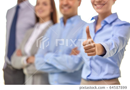 close up of happy businesswoman showing thumbs up 64587899