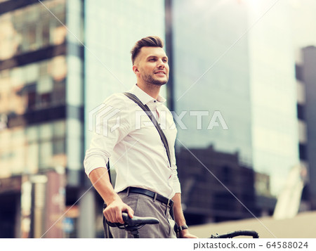 young man with bicycle on city street 64588024