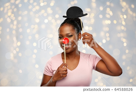 happy african american woman with red clown nose happy african american woman with red clown nose 64588026