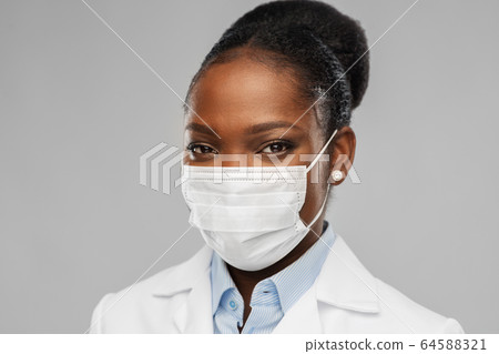 african american female doctor in facial mask african american female doctor in facial mask 64588321