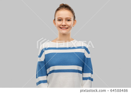smiling teenage girl in pullover smiling teenage girl in pullover 64588486