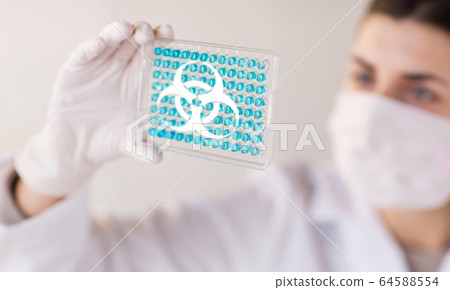 scientist making biohazard test in laboratory scientist making biohazard test in laboratory 64588554
