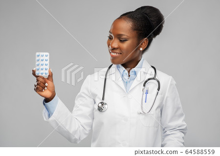 african american female doctor with medicine pills african american female doctor with medicine pills 64588559