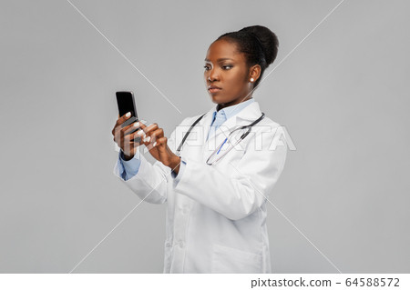 african american female doctor with smartphone african american female doctor with smartphone 64588572
