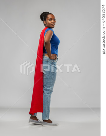 african american woman in red superhero cape 64588574