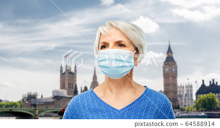senior woman in protective medical mask in england 64588914