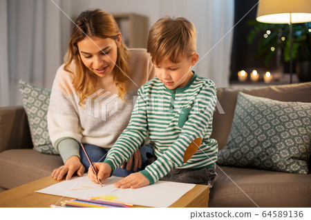 mother and son with pencils drawing at home 64589136