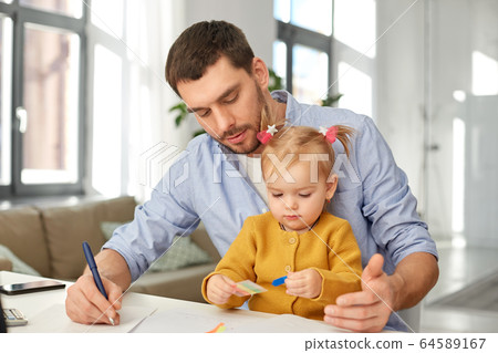 working father with baby daughter at home office working father with baby daughter at home office 64589167