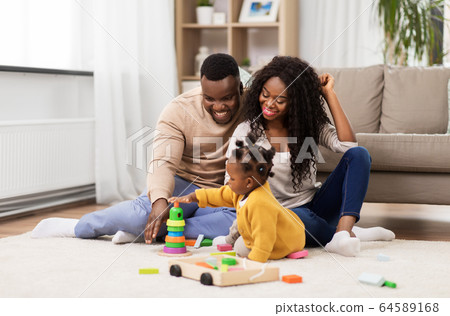 african family playing with baby daughter at home african family playing with baby daughter at home 64589168