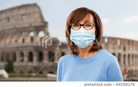 senior woman in protective medical mask in italy senior woman in protective medical mask in italy 64589179