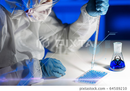 close up of scientist making test in lab close up of scientist making test in lab 64589210