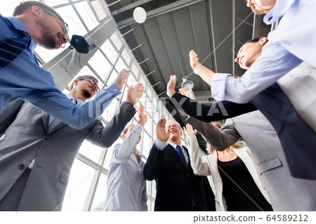 business people making high five at office business people making high five at office 64589212