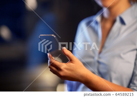 close up of hand with transparent smartphone close up of hand with transparent smartphone 64589215