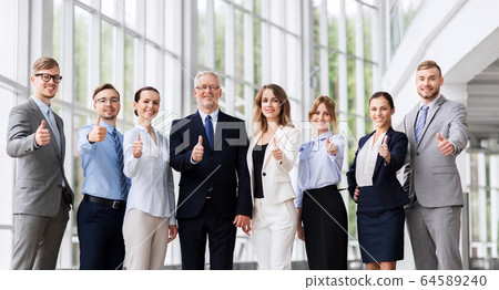 business people showing thumbs up at office business people showing thumbs up at office 64589240