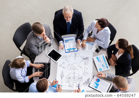 business team with scheme meeting at office business team with scheme meeting at office 64589247