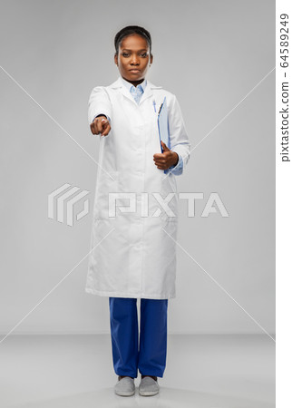 african female doctor pointing finger to camera african female doctor pointing finger to camera 64589249
