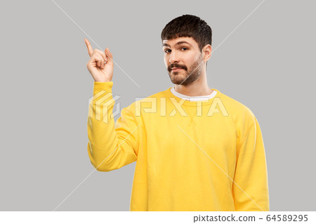 man pointing finger to something 64589295