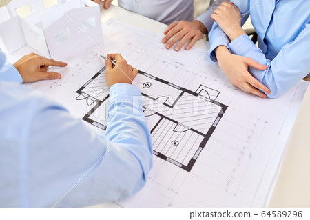 close up of architects with blueprint at office 64589296