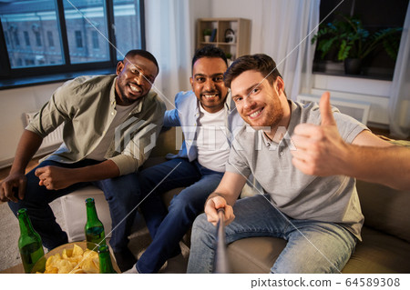 happy male friends with beer taking selfie at home happy male friends with beer taking selfie at home 64589308