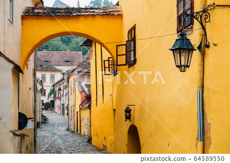 Sighisoara old town street in Romania 64589550