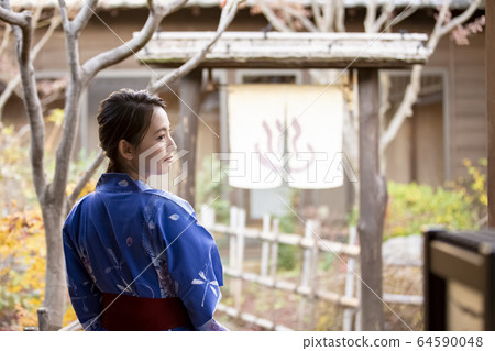 Woman enjoying a hot spring trip Woman enjoying a hot spring trip 64590048