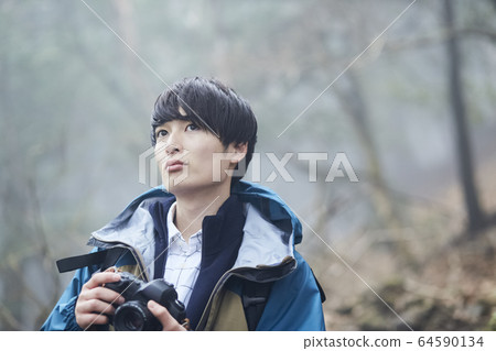 Men taking pictures in the mountains Men taking pictures in the mountains 64590134