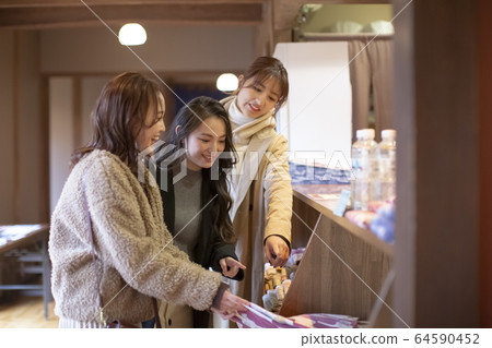 Women and friends enjoying a hot spring trip Women and friends enjoying a hot spring trip 64590452