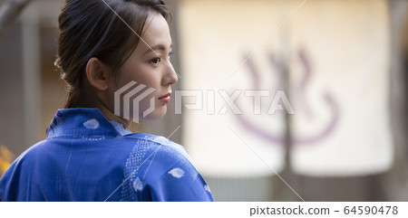 Woman enjoying a hot spring trip Woman enjoying a hot spring trip 64590478